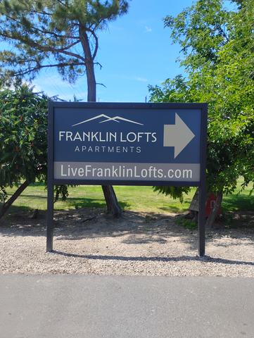 Franklin Lofts Apartments directional sign on two posts