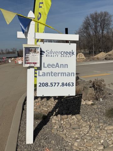 Silvercreek Realty Group listing sign with brochure box on a white vinyl post